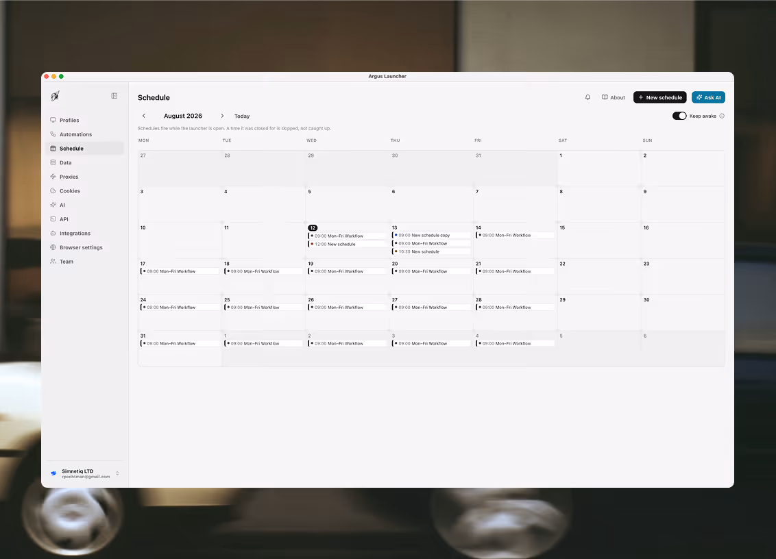 The Schedule tab showing August 2026 as a month grid. Weekday cells carry pills reading 09:00 Mon–Fri Workflow, each with a coloured dot and a status ring; two days carry a second and third entry. A line under the month reads that schedules fire while the launcher is open and a time it was closed for is skipped, not caught up. A Keep awake switch sits at the right of the same row.